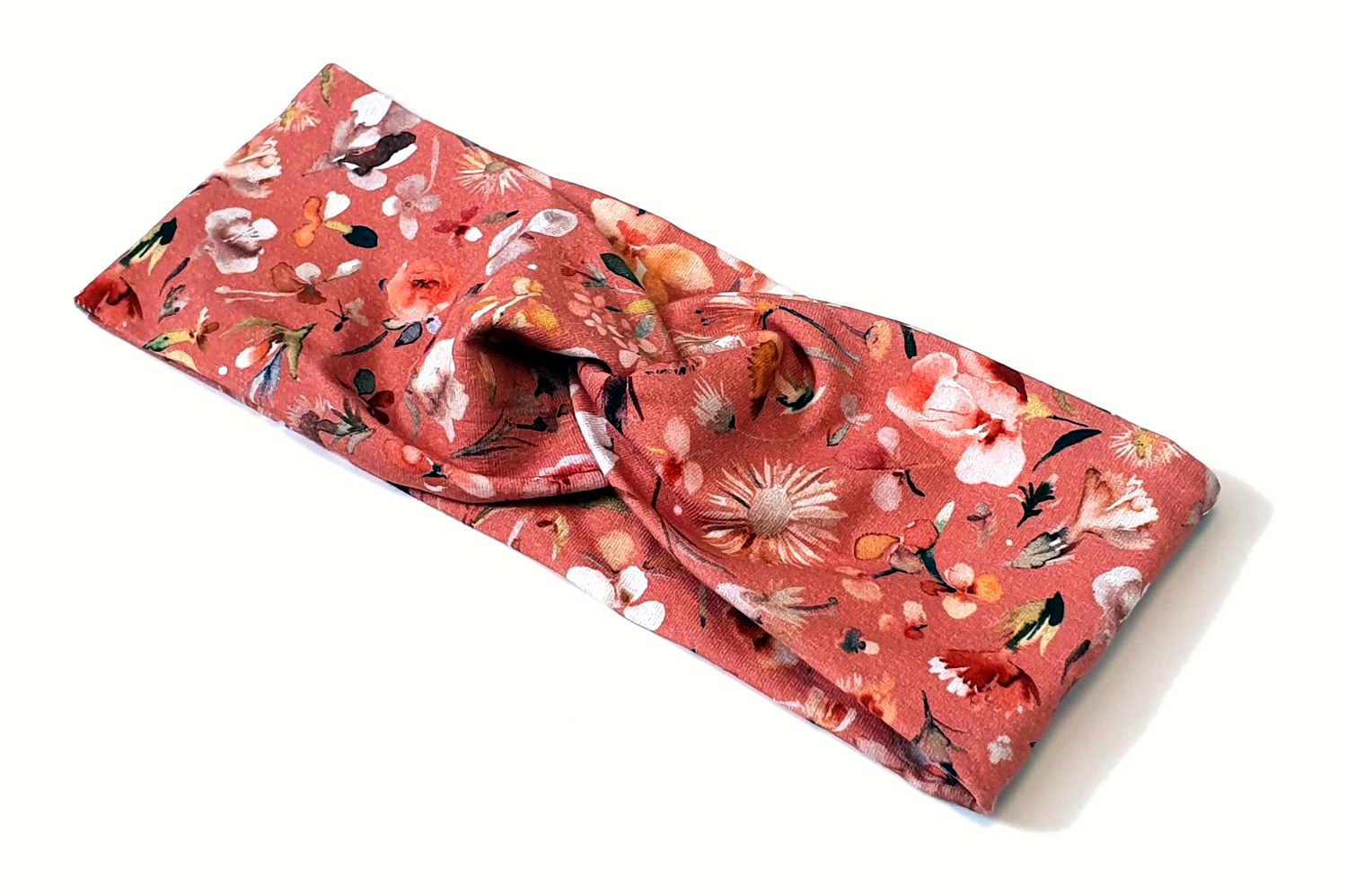 Korallfarbenes Stirnband mit Blumen